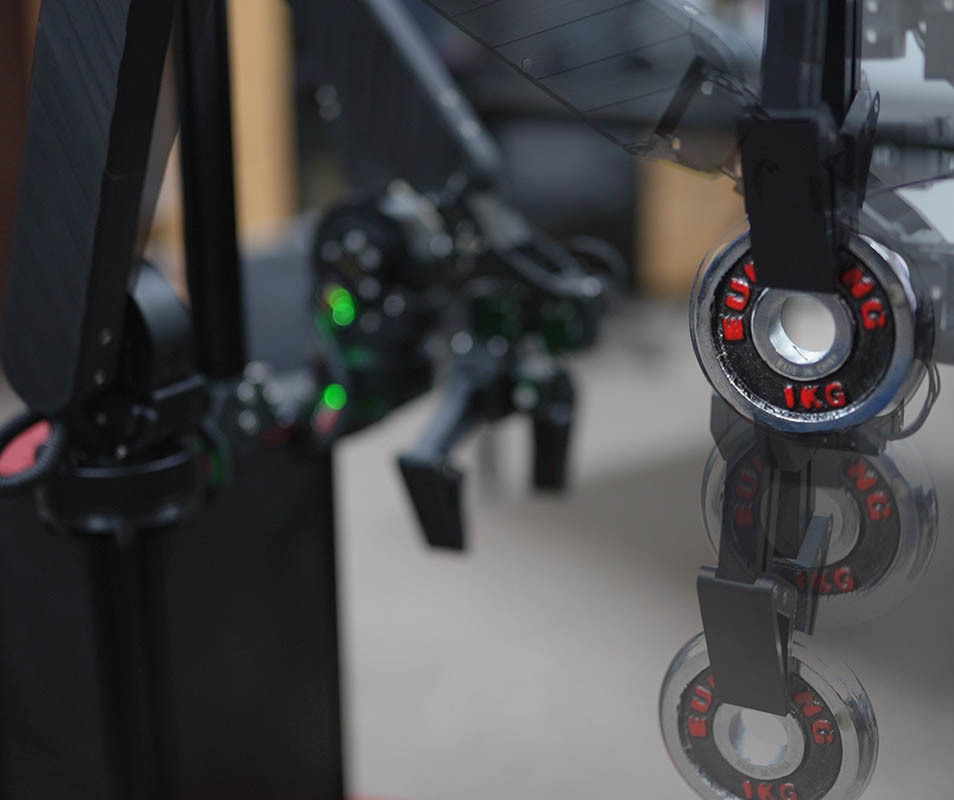 (a) The arm demonstrates compliant lifting of 1 kg payload. (b) The robot head integrates vision, audio, and a display for intuitive human interaction.