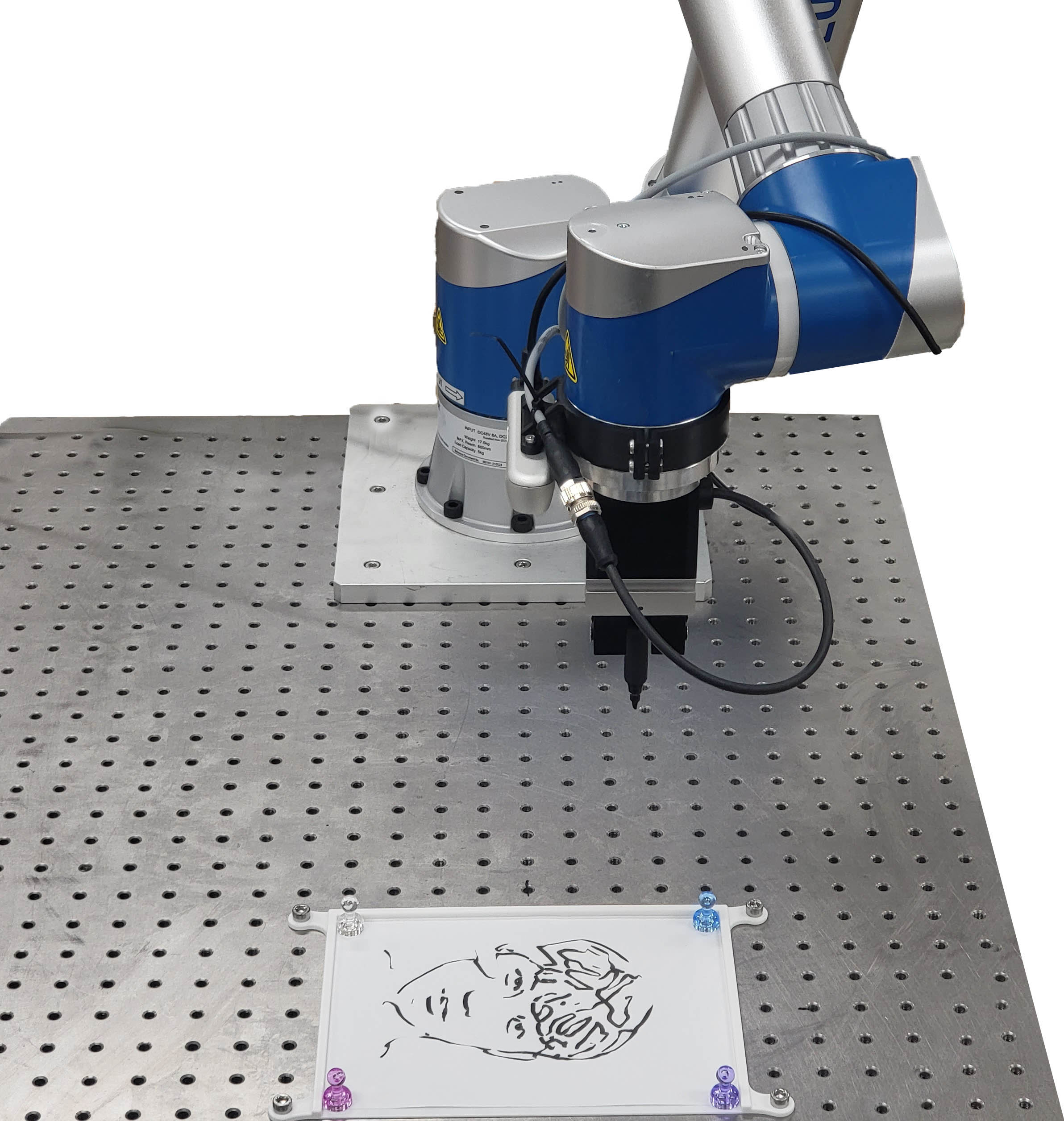 The proposed system for robotic portrait drawing and its output.